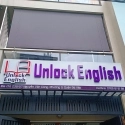 Bảng hiệu Unlock English
